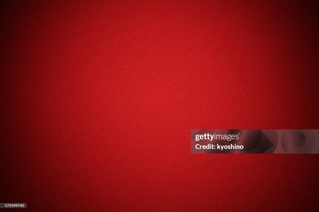 Red fabric texture background with spotlight