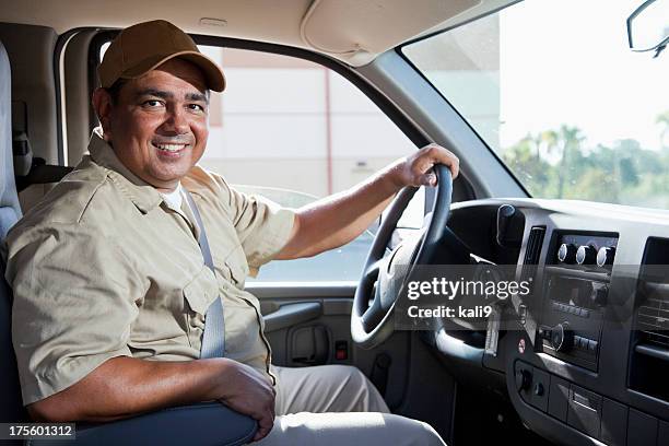 hispanic worker driving van - förare yrke bildbanksfoton och bilder