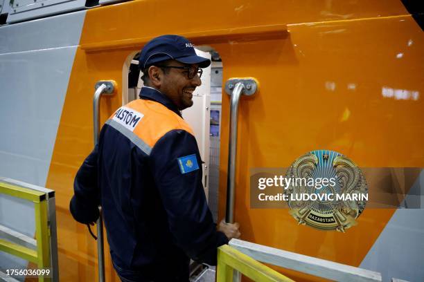 An Alstom engineer inspects a train locomotive ready for delivery to Kazakhstan's railway company, in Astana on October 31, 2023.