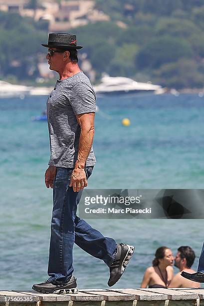 Sylvester Stallone is seen arriving at the 'Club 55' beach on August 4, 2013 in Saint-Tropez, France.