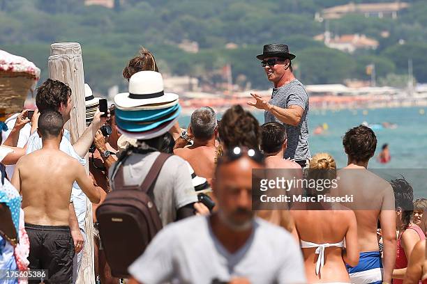 Sylvester Stallone is seen arriving at the 'Club 55' beach on August 4, 2013 in Saint-Tropez, France.
