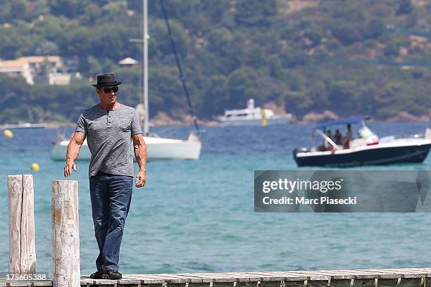 Sylvester Stallone is seen arriving at the 'Club 55' beach on August 4, 2013 in Saint-Tropez, France.