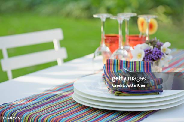 close up of tableware on a garden table - outdoor dining stock pictures, royalty-free photos & images