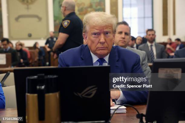 Former President Donald Trump sits in court during his civil fraud trial at New York State Supreme Court on October 25, 2023 in New York City. Trump...