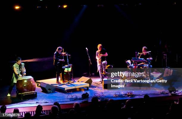 From left, Japanese musician Hiro Kurashima, on Japanese Taiko drum, and American musicians Laurie Anderson, on violin, John Zorn, on alto saxophone,...