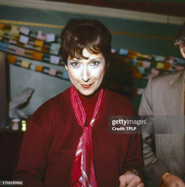 View of English actress Miriam Karlin as she makes a paper chain during an unspecified event, London, England, November 15, 1978.