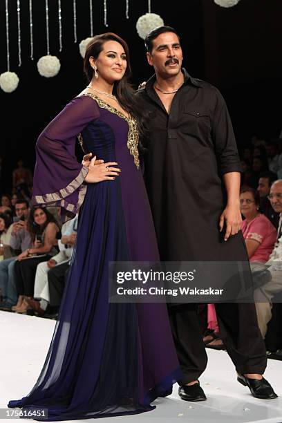 Akshay Kumar & Sonakshi Sinha walk the runway in Gitanjali design on day 1 of India International Jewellery Week 2013 at the Hotel Grand Hyatt on...