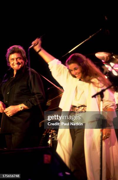 Johnny Cash with June Carter Cash at the first Farm Aid concert, held at Memorial Stadium, Champaign, Illinois, September 25, 1985.