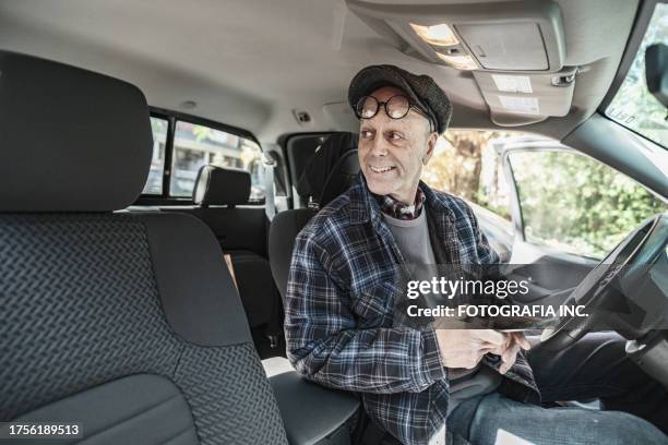 senior man using phone before driving pick up truck - slim stock pictures, royalty-free photos & images