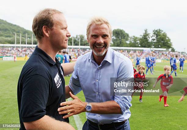 Head Coach Steffen Geisendorf of Jena and Head Coach Thorsten Fink of Hamburg during the DFB Cup between SV Schott Jena and Hamburger SV at...