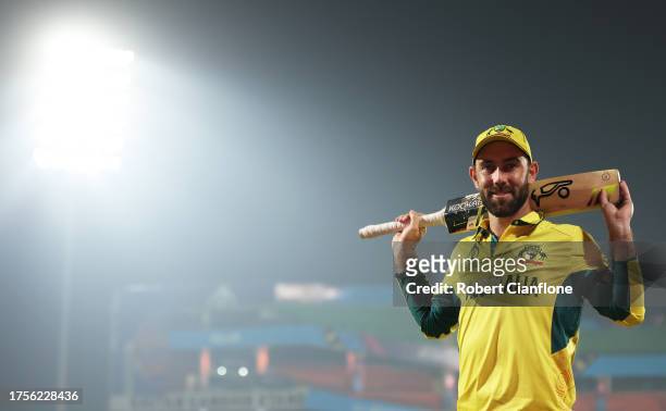 Glenn Maxwell of Australia poses for a photo following their 106, the fastest hundred in World Cup history following the ICC Men's Cricket World Cup...