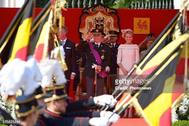 King Philippe and Queen Mathilde of Belgium watch the Military Parade on July 21, 2013 in Brussels, Belgium.