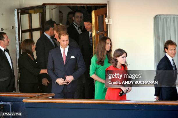 Prince William, Catherine and Princess Eugenie leave the pre-wedding drinks party of Queen Elizabeth II's eldest granddaughter Zara Phillips and her...