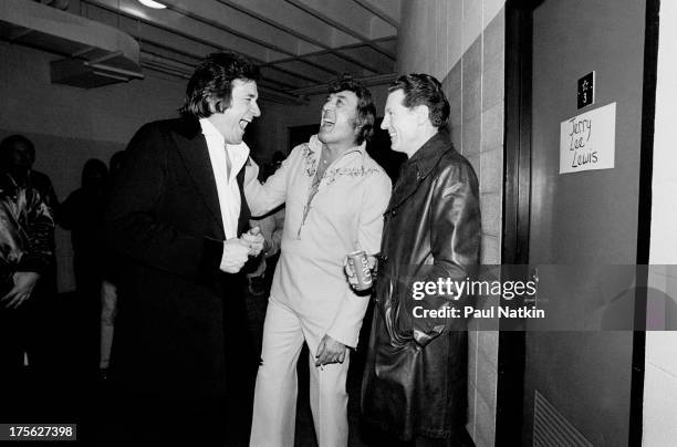 Singers Johnny Cash, Carl Perkins, and Jerry Lee Lewis at the Dane County Coliseum, Madison, Wisconsin, February 18, 1982.