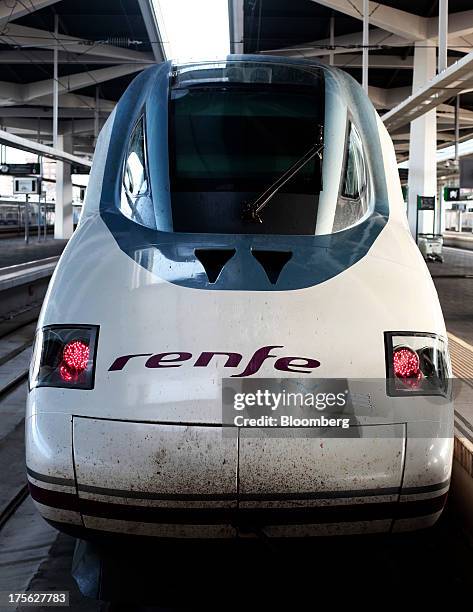 An Alta Velocidad Espanola high-speed train, operated by Renfe Operadora SC, sits alongside a platform at Joaquin Sorolla railway station in...