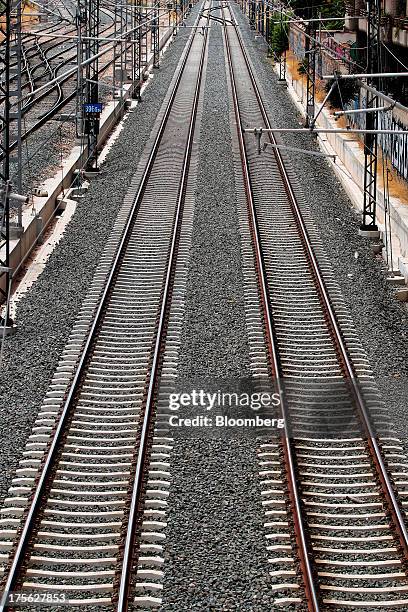 Railway tracks run beneath overhead power lines at Joaquin Sorolla train station in Valencia, Spain, on Saturday, Aug. 3, 2013. Spain's state-owned...