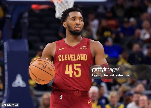 Donovan Mitchell of the Cleveland Cavaliers brings the ball up the court in the game against the Indiana Pacers at Gainbridge Fieldhouse on October...