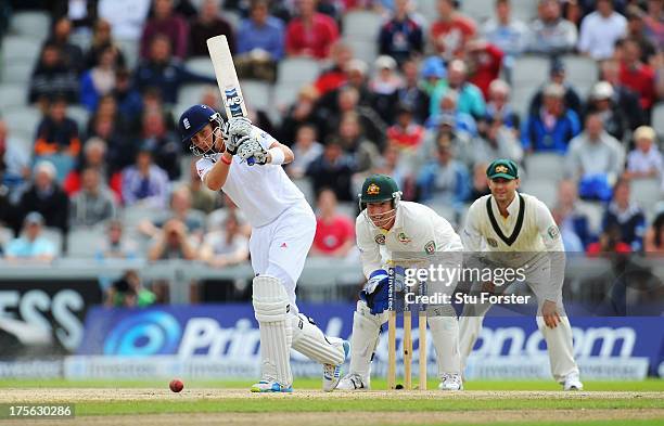 Joe Root of England hits out watched by wicketkeeper Brad Haddin and Michael Clarke of Australia during day five of the 3rd Investec Ashes Test match...