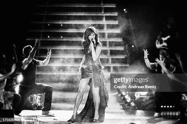 Andrea Berg performs on stage during the Andrea Berg Open Air festival 'Heimspiel' at comtech Arena on July 20, 2013 in Aspach near Stuttagrt,...