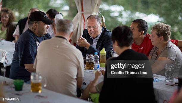 Peer Steinbrueck chancellor candidate of the German Social Democrats visits the 'AWO Ferienlager' on July 31, 2013 in Ziebel, Germany.