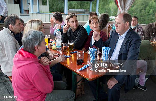 Peer Steinbrueck chancellor candidate of the German Social Democrats visits the 'AWO Ferienlager' on July 31, 2013 in Ziebel, Germany.