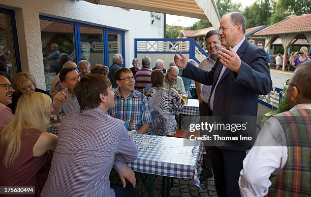 Peer Steinbrueck chancellor candidate of the German Social Democrats visits the 'AWO Ferienlager' on July 31, 2013 in Ziebel, Germany.