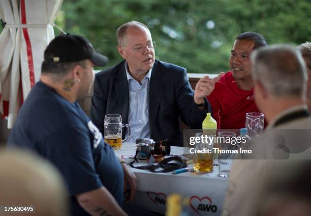 Peer Steinbrueck chancellor candidate of the German Social Democrats visits the 'AWO Ferienlager' on July 31, 2013 in Ziebel, Germany.