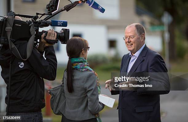 Peer Steinbrueck chancellor candidate of the German Social Democrats gives a TV interview while he visits the 'AWO Ferienlager' on July 31, 2013 in...