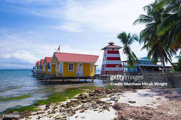 a lighthouse building is part of this hotel - bocas del toro stock pictures, royalty-free photos & images