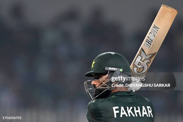 Pakistan's Fakhar Zaman watches the ball after playing a shot during the 2023 ICC Men's Cricket World Cup one-day international match between...