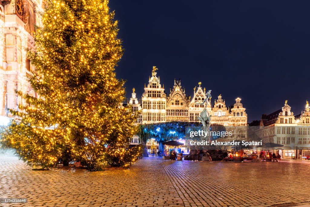 Illuminated Christmas tree and Christmas market at Grote Markt, Antwerpen, Belgium