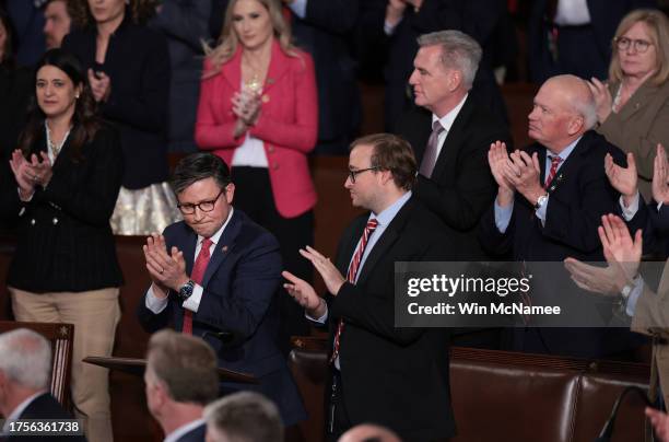 Rep. Mike Johnson applauds alongside fellow lawmakers as the House of Representatives holds an election for a new Speaker of the House at the U.S....