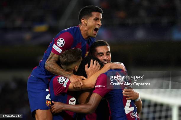 Ferran Torres of FC Barcelona celebrates with teammates after scoring the team's first goal during the UEFA Champions League match between FC...