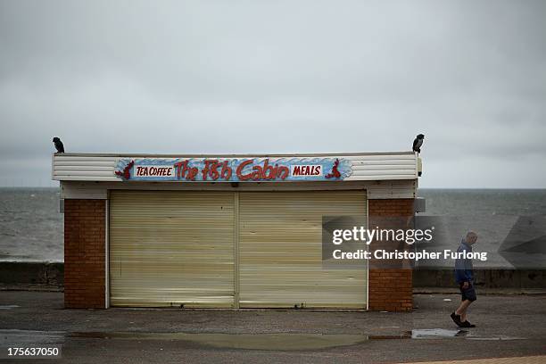Man walks along Rhyl Promenade on August 5, 2013 in Rhyl, Wales. The think tank The Centre for Social Justice has today said that some British...