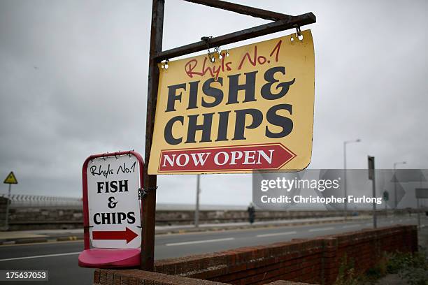 Fish and chip shop sign tries to entice customers on Rhyl Promenade on August 5, 2013 in Rhyl, Wales. The think tank The Centre for Social Justice...