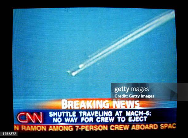 Television frame grab shows the breakup of the space shuttle Columbia minutes before a scheduled landing February 1, 2003 as it crossed the United...