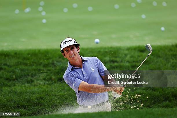 Gonzalo Fernandez-Castano of Spain plays a shot from a bunker on the practice range during a practice round prior to the start of the 95th PGA...