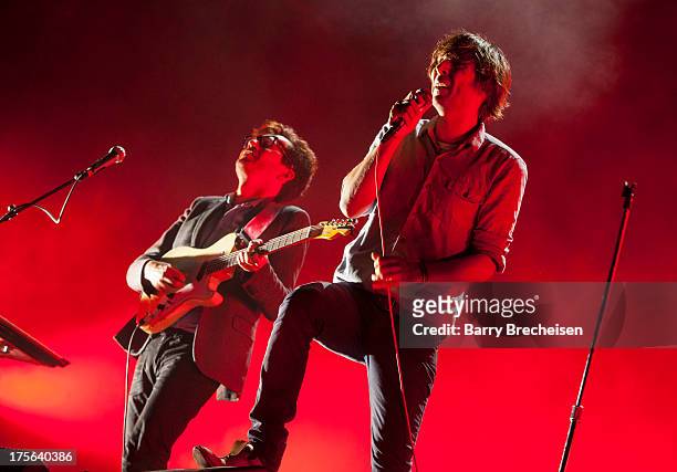 Christian Mazzala and Thomas Mars of Phoenix perform during Lollapalooza 2013 at Grant Park on August 4, 2013 in Chicago, Illinois.