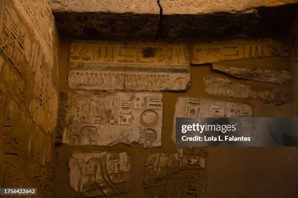 karnak temple, caved old signs and hieroglyphics. luxor, egypt. - caved stock pictures, royalty-free photos & images