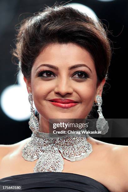 Kajal Aggarwal walks the runway at the Moni Agarwal show on day 2 of India International Jewellery Week 2013 at the Hotel Grand Hyatt on August 5,...