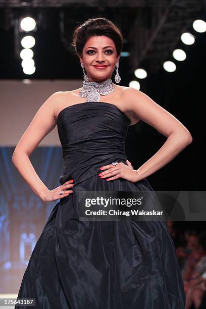 Kajal Aggarwal walks the runway at the Moni Agarwal show on day 2 of India International Jewellery Week 2013 at the Hotel Grand Hyatt on August 5,...