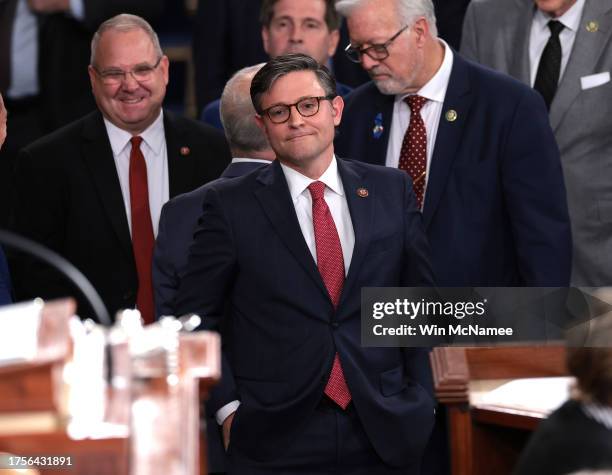 Rep. Mike Johnson watches as House Minority Leader Hakeem Jeffries delivers remarks after Johnson was elected as the new Speaker of the House at the...