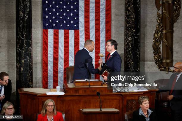 House Minority Leader Hakeem Jeffries hands the gavel to newly elected Speaker of the House Mike Johnson after the House of Representatives held an...