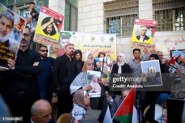 People gather to stage a demonstration in support of Palestinian prisoners in Israeli jails those who are went on hunger strike, in front of the...