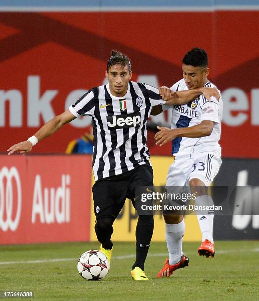 Jose Martin Caceres Silva of Juventus controls the ball against Jose Villareal of Los Angeles Galaxy during 2013 Guinness International Champions Cup...