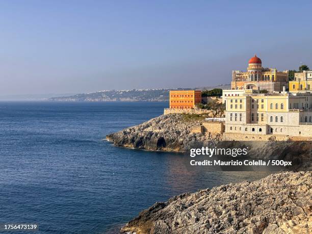 scenic view of sea by buildings against clear sky,santa cesarea terme,puglia,italy - cesarea 個照片及圖片檔