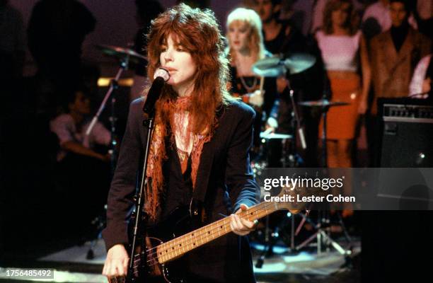 American bassist, guitarist, songwriter, and singer Michael Steele, of the American pop rock band The Bangles, sings on stage during an appearance on...