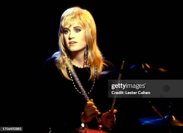 American drummer Debbi Peterson, of the American pop rock band The Bangles, plays her drums during the filming of a music video in Los Angeles,...