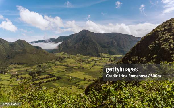 scenic view of agricultural field against sky,pululahua,ecuador - ecuador landscape stock pictures, royalty-free photos & images