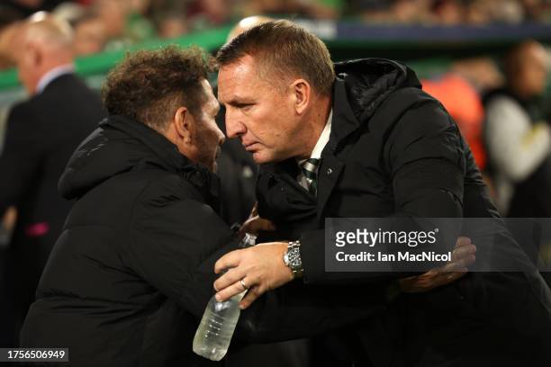 Diego Simeone, Head Coach of Atletico Madrid, and Brendan Rodgers, Manager of Celtic, interact prior to the UEFA Champions League match between...
